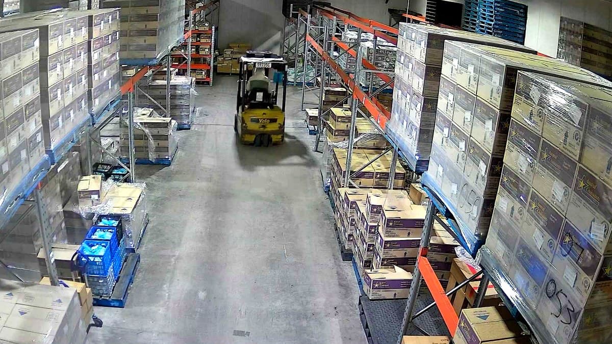 Freezer aisle with a forklift and racked pallets at the Rocklea facility